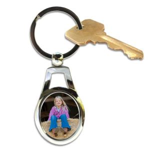 Customize your own key ring shaped like an oval, just add your own picture